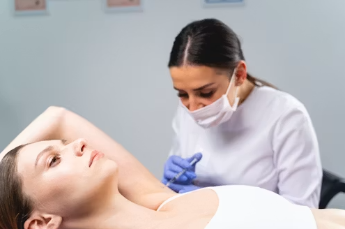 Doctor preparing a joint injection