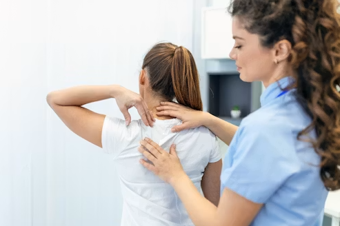 Doctor examining a patient's neck after a collision